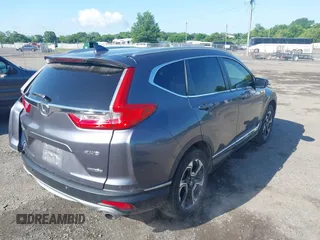2018 Honda CR-V Touring z VIN 5J6RW2H93JL004834, wystawiony jako IAAI lot #42351364 z przebiegiem 63 746 mil mil oraz . Historia ofert i sprzedaży dostępna na DreamBid. Obrazek 4.