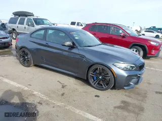 2018 BMW M2 with VIN WBS1J5C50JVE51869, listed as a IAAI auction lot 41814404 with 69,684 mi miles. Bid and sale history available at carsss.com. Image 1.