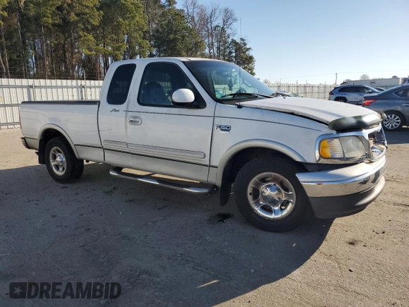 2000 Ford F-150 XL with VIN 1FTRX17L1YNA26050, listed as a Copart auction lot 43597105 with 205,152 mi miles and Salvage Title. Bid and sale history available at carsss.com. Image 4.