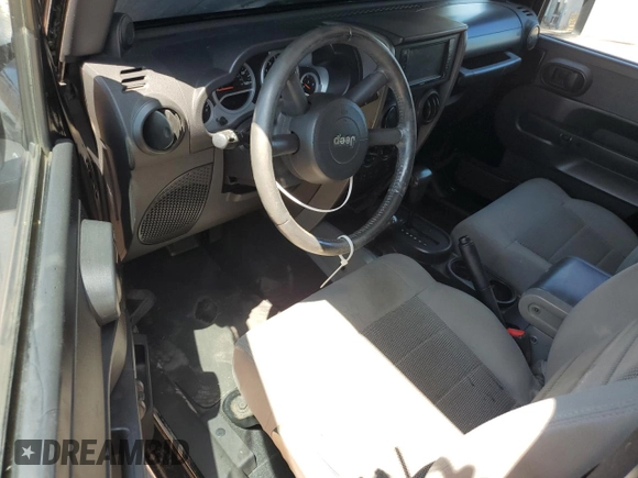 2009 Jeep Wrangler Rubicon with VIN 1J4GA64179L703716, listed as a Copart auction lot 61084215 with 190,262 mi miles and Salvage title. Bid and sale history available at DreamBid. Image 8.