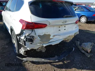 2019 Hyundai Santa Fe SE with VIN 5NMS2CAD2KH020288, listed as a IAAI auction lot 41398304 with 136,693 mi miles and . Bid and sale history available at DreamBid. Image 6.