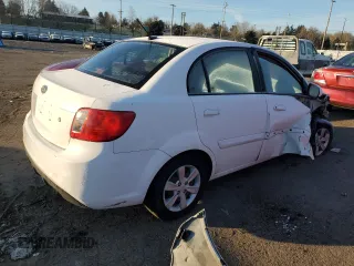 2010 Kia Rio LX with VIN KNADH4A35A6691869, listed as a Copart auction lot 42025785 with 126,381 mi miles and Salvage Title. Bid and sale history available at carsss.com. Image 3.