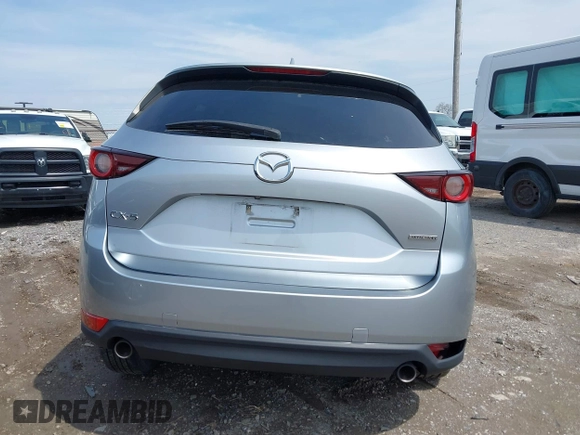 2020 Mazda CX-5 Touring with VIN JM3KFACM9L0785464, listed as a IAAI auction lot 42023311 with 90,062 mi miles and . Bid and sale history available at DreamBid. Image 16.