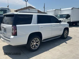 2015 GMC Yukon SLE with VIN 1GKS1AKCXFR513784, listed as a Copart auction lot 54203395 with 219,112 mi miles and Clean Title. Bid and sale history available at carsss.com. Image 4.