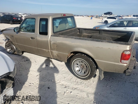 1999 Ford Ranger XLT with VIN 1FTYR14X1XPB75400, listed as a Copart auction lot 80879084 with 255,136 mi miles and Salvage Title. Bid and sale history available at DreamBid. Image 2.