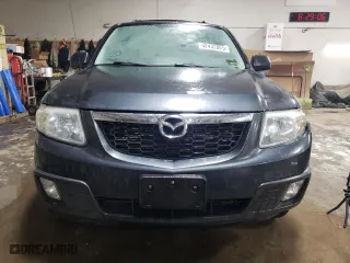 2010 Mazda Tribute Touring with VIN 4F2CY9C70AKM07812, listed as a Copart auction lot 42432055 with 132,562 mi miles and Salvage Title. Bid and sale history available at carsss.com. Image 5.