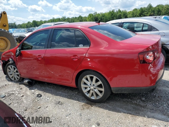 2010 Volkswagen Jetta Wolfsburg Edition with VIN 3VWRJ7AJXAM154666, listed as a Copart auction lot 60556875 with 149,509 mi miles and Salvage title. Bid and sale history available at DreamBid. Image 2.