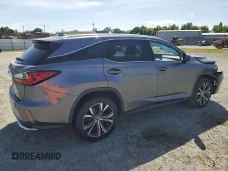 2020 Lexus RX 350L with VIN JTJHZKFA4L2027079, listed as a Copart auction lot 57151485 with 60,890 mi miles and Salvage title. Bid and sale history available at DreamBid. Image 3.