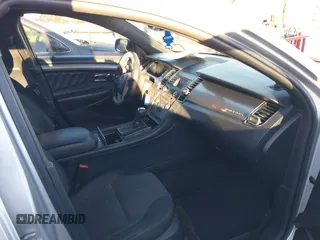 2014 Ford Taurus SEL z VIN 1FAHP2E87EG121069, wystawiony jako IAAI lot #41030422 z przebiegiem 138 043 mil mil oraz . Historia ofert i sprzedaży dostępna na DreamBid. Obrazek 5.