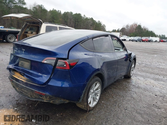 2023 Tesla Model Y Long Range with VIN 7SAYGDEE7PF673988, listed as a IAAI auction lot 41057651 with 29,683 mi miles and . Bid and sale history available at DreamBid. Image 4.