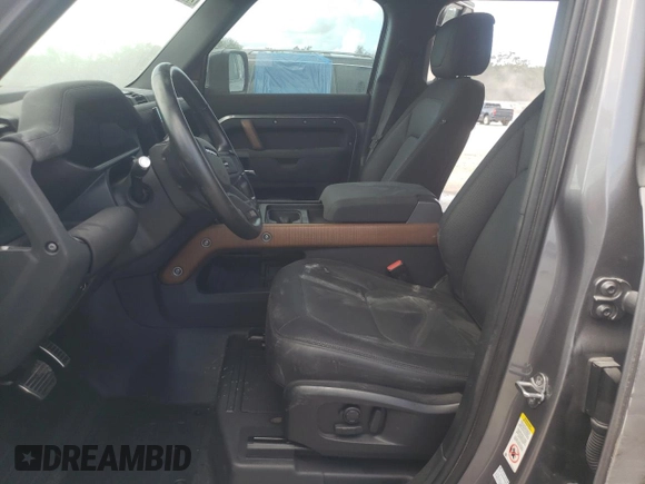 2023 Land Rover Defender X with VIN SALEXEEU6P2136280, listed as a Copart auction lot 77014604 with 27,736 mi miles and Salvage title. Bid and sale history available at DreamBid. Image 7.