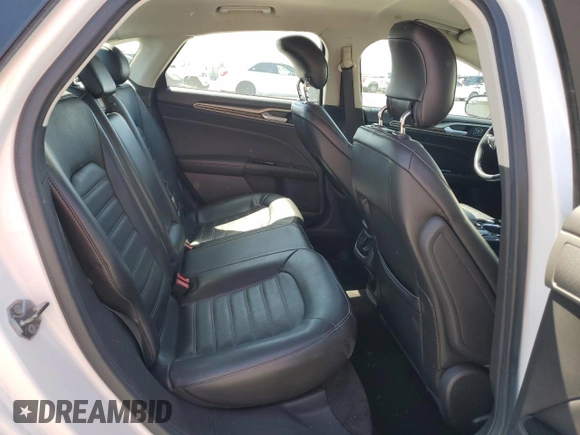 2013 Ford Fusion SE Hybrid z VIN 3FA6P0LU6DR325719, wystawiony jako Copart lot #55777715 z przebiegiem 152 478 mil mil oraz Szkoda całkowita • Salvage title. Historia ofert i sprzedaży dostępna na DreamBid. Obrazek 10.