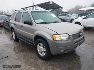2001 Ford Escape XLT with VIN 1FMYU041X1KE70466, listed as a IAAI auction lot 41542707 with 182,364 mi miles. Bid and sale history available at carsss.com. Image 1.
