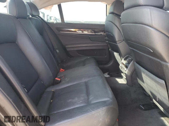 2011 BMW 7 Series 740i with VIN WBAKA4C57BC612487, listed as a Copart auction lot 82633554 with 0 mi miles and Salvage Title. Bid and sale history available at carsss.com. Image 10.