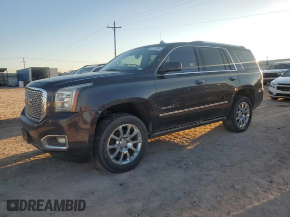 2015 GMC Yukon Denali with VIN 1GKS1CKJ7FR132677, listed as a Copart auction lot 82118584 with 144,798 mi miles and Salvage Title. Bid and sale history available at carsss.com. Image 1.