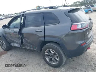 2019 Jeep Cherokee Trailhawk z VIN 1C4PJMBX1KD314121, wystawiony jako IAAI lot #42106721 z przebiegiem 105 631 mil mil oraz . Historia ofert i sprzedaży dostępna na DreamBid. Obrazek 14.
