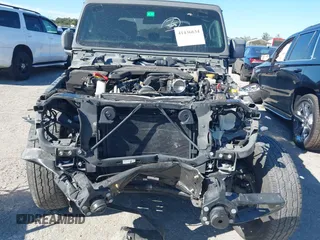 2021 Jeep Gladiator Willys with VIN 1C6HJTAG4ML517715, listed as a IAAI auction lot 41436634 with 21,187 mi miles and . Bid and sale history available at DreamBid. Image 6.