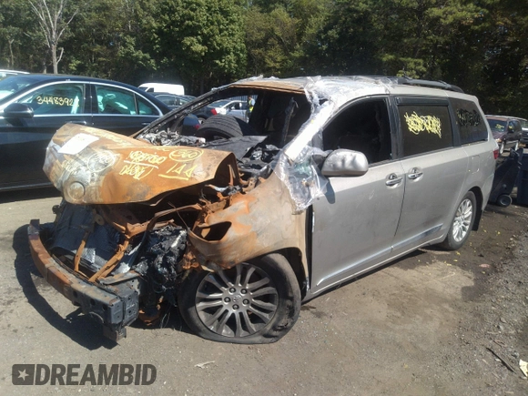 2015 Toyota Sienna XLE with VIN 5TDYK3DC1FS657933, listed as a IAAI auction lot 34212306 with 107,281 mi miles and . Bid and sale history available at DreamBid. Image 2.