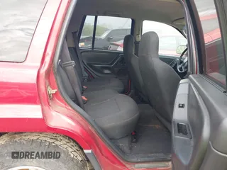2004 Jeep Grand Cherokee Laredo with VIN 1J4GW48S64C371253, listed as a IAAI auction lot 42099607 with 260,618 mi miles. Bid and sale history available at carsss.com. Image 8.