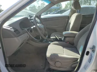 2002 Toyota Camry LE z VIN 4T1BE32K12U055722, wystawiony jako Copart lot #56522495 z przebiegiem 256 565 mil mil oraz Szkoda całkowita • Salvage title. Historia ofert i sprzedaży dostępna na DreamBid. Obrazek 7.