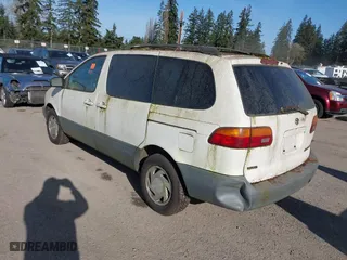 1998 Toyota Sienna LE with VIN 4T3ZF13C1WU052050, listed as a IAAI auction lot 41921780 with 144,769 mi miles. Bid and sale history available at carsss.com. Image 3.