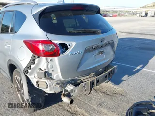 2016 Mazda CX-5 Grand Touring z VIN JM3KE2DY8G0709573, wystawiony jako IAAI lot #42021005 z przebiegiem 113 941 mil mil oraz . Historia ofert i sprzedaży dostępna na DreamBid. Obrazek 6.