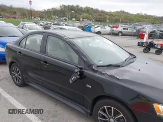 2015 Mitsubishi Lancer SE with VIN JA32V2FW2FU002303, listed as a IAAI auction lot 41927592 with 32,444 mi miles. Bid and sale history available at carsss.com. Image 6.