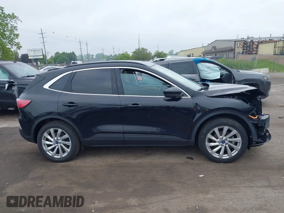 2021 Ford Escape Titanium Hybrid with VIN 1FMCU9DZ5MUA18079, listed as a IAAI auction lot 42340093 with 71,630 mi miles and . Bid and sale history available at DreamBid. Image 13.