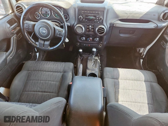 2012 Jeep Wrangler Unlimited Sport with VIN 1C4BJWDG9CL187421, listed as a Copart auction lot 61411145 with 140,390 mi miles and Clean title. Bid and sale history available at DreamBid. Image 8.