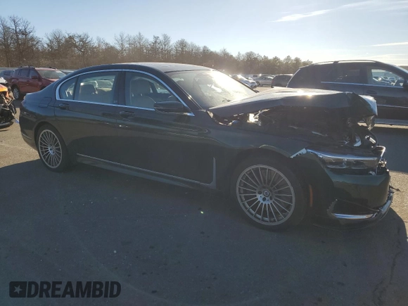 2022 BMW 7 Series with VIN WBA7U2C11NCJ22940, listed as a Copart auction lot 87848125 with 37,023 mi miles and Salvage title. Bid and sale history available at DreamBid. Image 4.