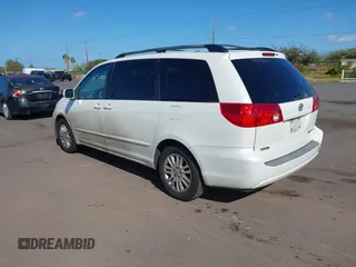 2010 Toyota Sienna XLE with VIN 5TDYK4CC3AS336590, listed as a IAAI auction lot 41798194 with 230,707 mi miles. Bid and sale history available at carsss.com. Image 3.