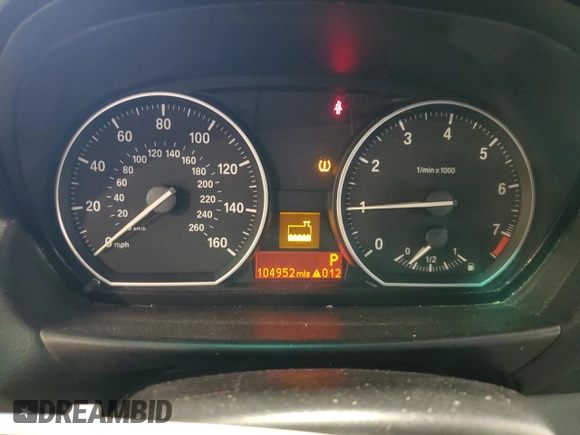 2011 BMW 1 Series 128i with VIN WBAUL7C57BVM80274, listed as a Copart auction lot 52127595 with 104,952 mi miles and Salvage title. Bid and sale history available at DreamBid. Image 9.