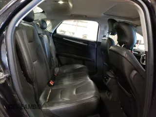 2014 Ford Fusion Titanium Hybrid z VIN 3FA6P0RUXER168706, wystawiony jako Copart lot #55362295 z przebiegiem 136 382 mil mil oraz Czysty tytuł • Clean title. Historia ofert i sprzedaży dostępna na DreamBid. Obrazek 10.