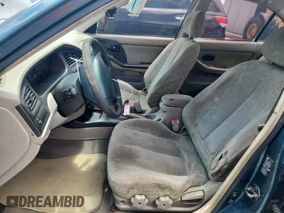 2001 Hyundai Elantra GLS z VIN KMHDN45D61U132398, wystawiony jako Copart lot #61164165 z przebiegiem 162 729 mil mil oraz Szkoda całkowita • Salvage title. Historia ofert i sprzedaży dostępna na DreamBid. Obrazek 7.