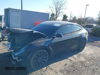 2022 Tesla Model Y Performance with VIN 7SAYGDEF0NF447460, listed as a IAAI auction lot 41670250 with 28,287 mi miles. Bid and sale history available at carsss.com. Image 21.