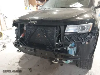 2014 Jeep Grand Cherokee Overland with VIN 1C4RJFCGXEC162109, listed as a IAAI auction lot 41943979 with 147,788 mi miles. Bid and sale history available at carsss.com. Image 12.