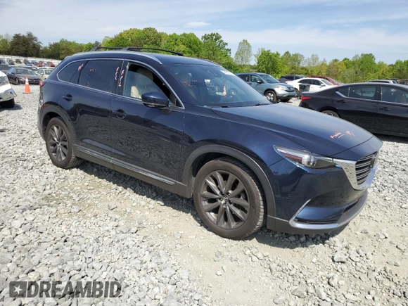2016 Mazda CX-9 Grand Touring with VIN JM3TCBDY0G0116686, listed as a Copart auction lot 54077335 with 142,670 mi miles and Salvage title. Bid and sale history available at DreamBid. Image 4.