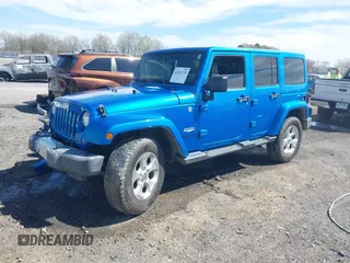 2015 Jeep Wrangler Unlimited Sahara z VIN 1C4HJWEG5FL650829, wystawiony jako IAAI lot #41824739 z przebiegiem 127 719 mil mil oraz . Historia ofert i sprzedaży dostępna na DreamBid. Obrazek 2.
