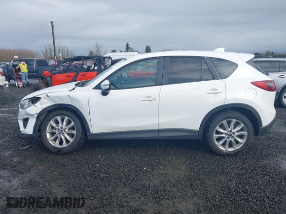 2015 Mazda CX-5 Grand Touring with VIN JM3KE4DY0F0483037, listed as a IAAI auction lot 41578222 with 102,988 mi miles. Bid and sale history available at carsss.com. Image 14.