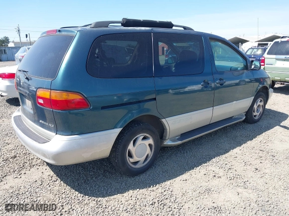1998 Toyota Sienna LE with VIN 4T3ZF13CXWU023663, listed as a IAAI auction lot 42011727 with 214,972 mi miles. Bid and sale history available at carsss.com. Image 4.