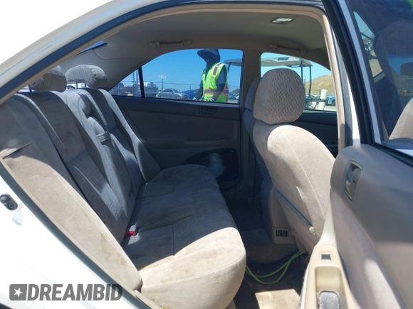 2002 Toyota Camry LE z VIN 4T1BE32K82U038819, wystawiony jako IAAI lot #42301111 z przebiegiem 189 166 mil mil oraz . Historia ofert i sprzedaży dostępna na DreamBid. Obrazek 8.