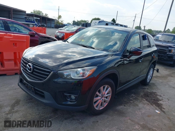 2016 Mazda CX-5 Touring with VIN JM3KE2CY5G0653108, listed as a IAAI auction lot 37717249 with 90,704 mi miles and . Bid and sale history available at DreamBid. Image 18.