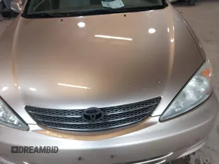 2004 Toyota Camry LE z VIN 4T1BE32K84U896326, wystawiony jako IAAI lot #42409807 z przebiegiem 163 984 mil mil oraz . Historia ofert i sprzedaży dostępna na DreamBid. Obrazek 6.