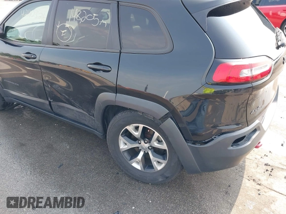 2015 Jeep Cherokee Trailhawk with VIN 1C4PJMBS6FW786622, listed as a IAAI auction lot 42403215 with 148,205 mi miles and . Bid and sale history available at DreamBid. Image 6.