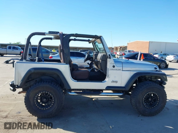 2002 Jeep Wrangler X with VIN 1J4FA39S42P763835, listed as a IAAI auction lot 42302645 with 233,634 mi miles and . Bid and sale history available at DreamBid. Image 14.