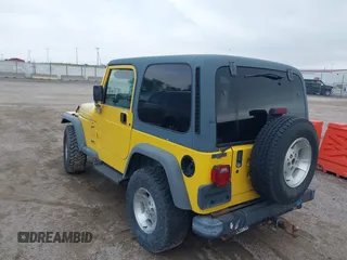 2000 Jeep Wrangler Sport with VIN 1J4FA49S3YP781614, listed as a IAAI auction lot 42292668 with 152,600 mi miles and . Bid and sale history available at DreamBid. Image 6.