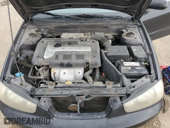 2003 Hyundai Elantra GLS z VIN KMHDN45D63U594320, wystawiony jako Copart lot #58742565 z przebiegiem 163 772 mil mil oraz Szkoda całkowita • Salvage title. Historia ofert i sprzedaży dostępna na DreamBid. Obrazek 11.