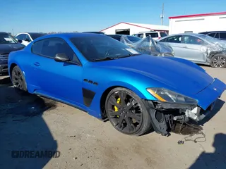 2013 Maserati GranTurismo Sport with VIN ZAM45VLA5D0070499, listed as a IAAI auction lot 41284315 with 50,156 mi miles. Bid and sale history available at carsss.com. Image 1.
