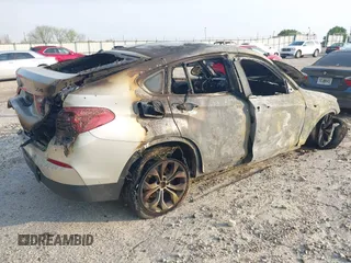 2015 BMW X4 xDrive28i with VIN 5UXXW3C54F0M88902, listed as a IAAI auction lot 42037787 with Not provided miles and . Bid and sale history available at DreamBid. Image 4.