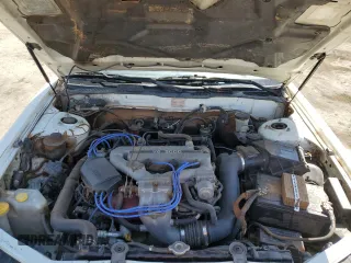 1990 Nissan Maxima z VIN JN1HJ01PXLT390008, wystawiony jako Copart lot #53529815 z przebiegiem 163 186 mil mil oraz Tytuł czysty. Historia ofert i sprzedaży dostępna na DreamBid. Obrazek 11.